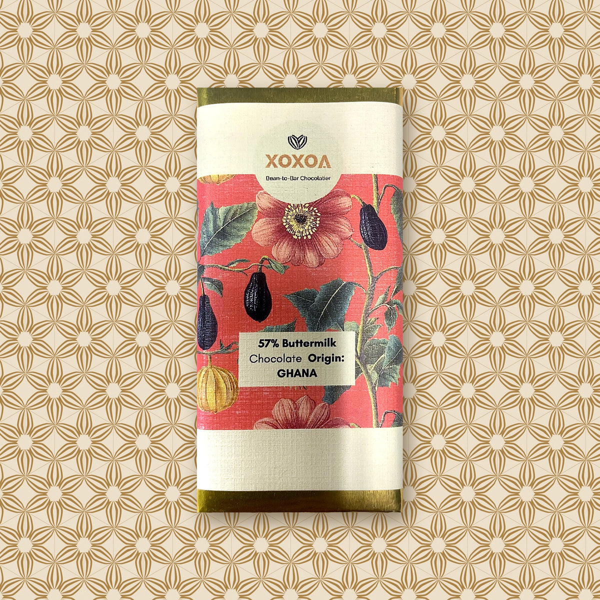 Ghana 57% buttermilk chocolate bar, 42g, in the coral botanical Xoxoa sleeve over gold foil