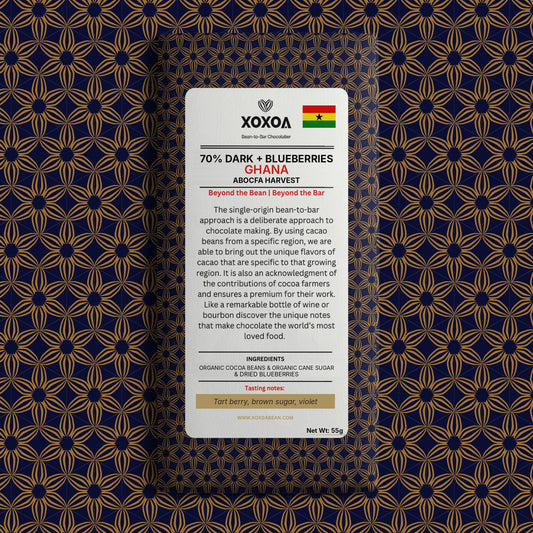 Ghana 70% dark chocolate bar with blueberries in the navy and gold Xoxoa wrapper