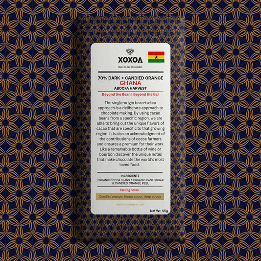 Ghana 70% dark chocolate bar with candied orange in the navy and gold Xoxoa wrapper