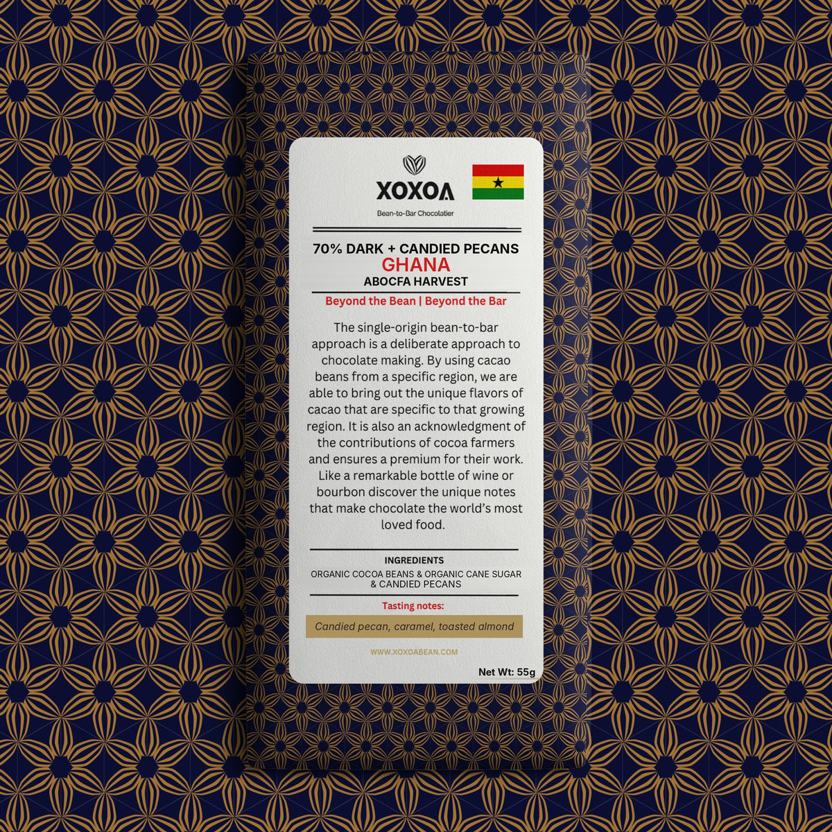 Ghana 70% dark chocolate bar with candied pecans in the navy and gold Xoxoa wrapper