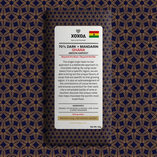 Ghana 70% dark chocolate bar with mandarin in the navy and gold Xoxoa wrapper