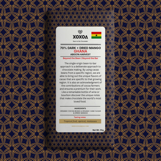 Ghana 70% dark chocolate bar with dried mango in the navy and gold Xoxoa wrapper