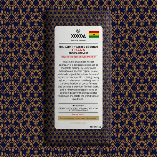 Ghana 70% dark chocolate bar with toasted coconut in the navy and gold Xoxoa wrapper