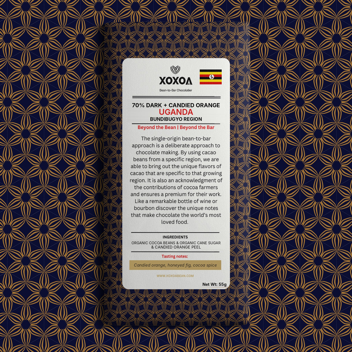 Uganda 70% dark chocolate bar with candied orange in the navy and gold Xoxoa wrapper