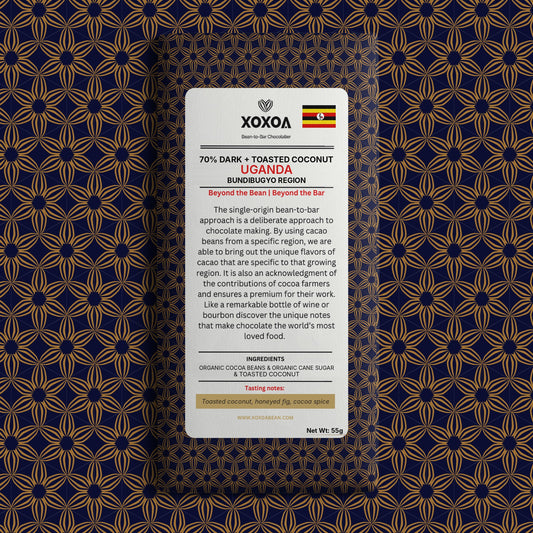 Uganda 70% dark chocolate bar with toasted coconut in the navy and gold Xoxoa wrapper